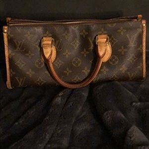 Louis Vuitton small handheld triangle bag